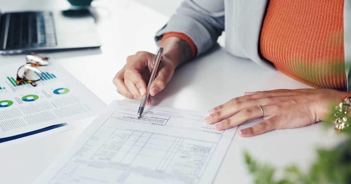 Woman working on financial paperwork